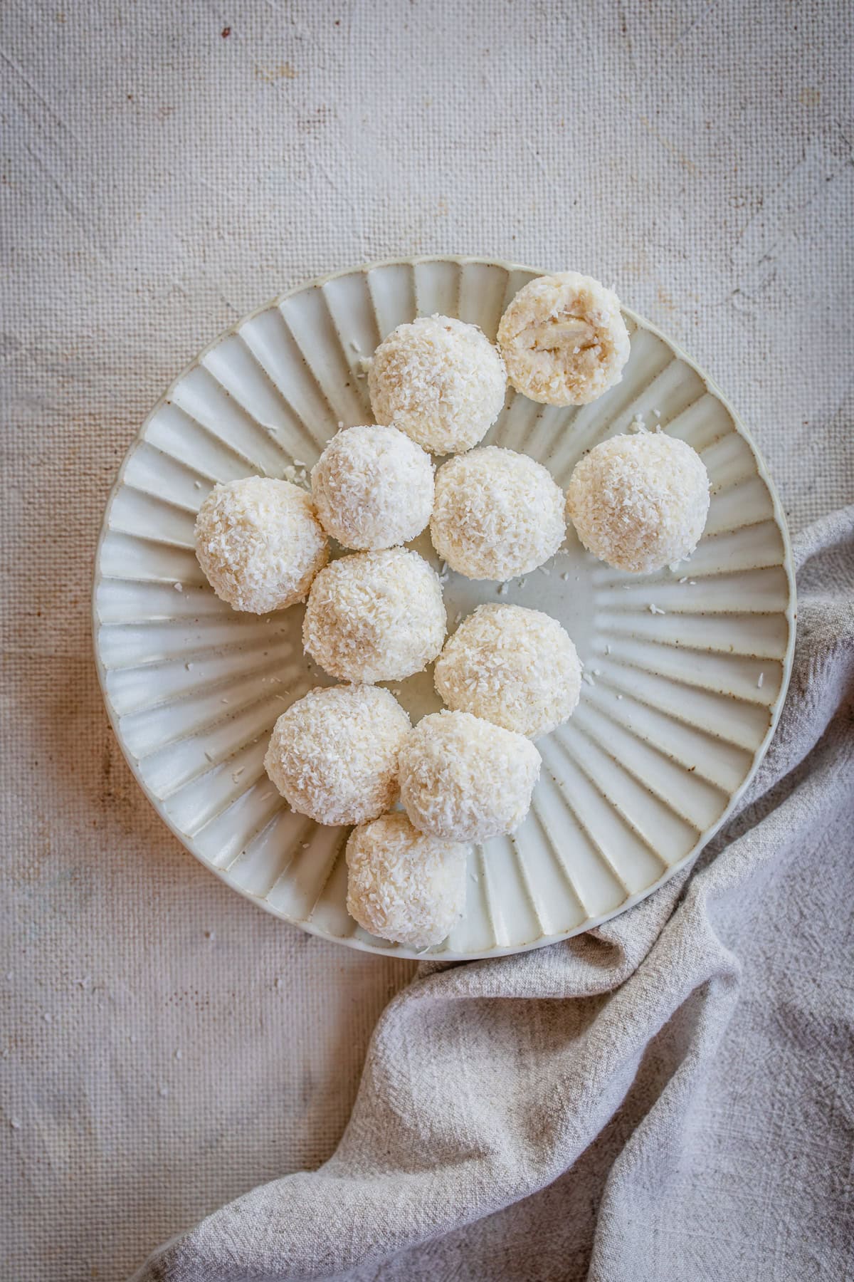 raffaello truffles on a cream background and plate