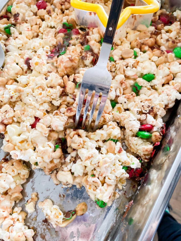 Cutting into a tray of popcorn shaped into stars instead of serving Christmas cookies.