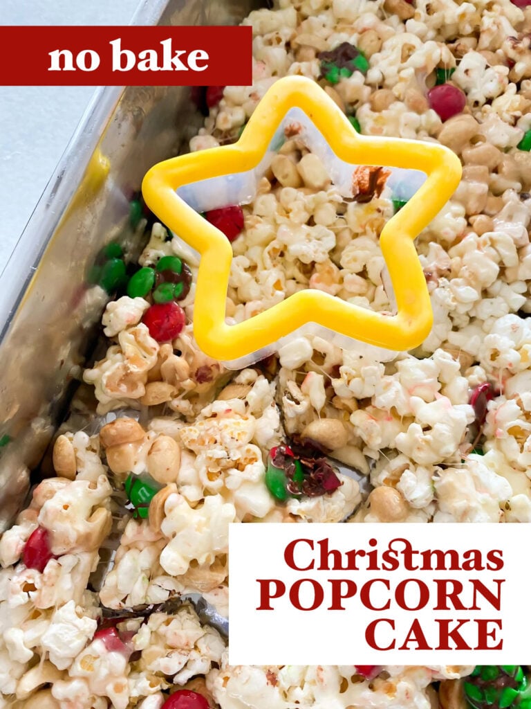 no bake Christmas Popcorn Cake in pan with cookie cutter.