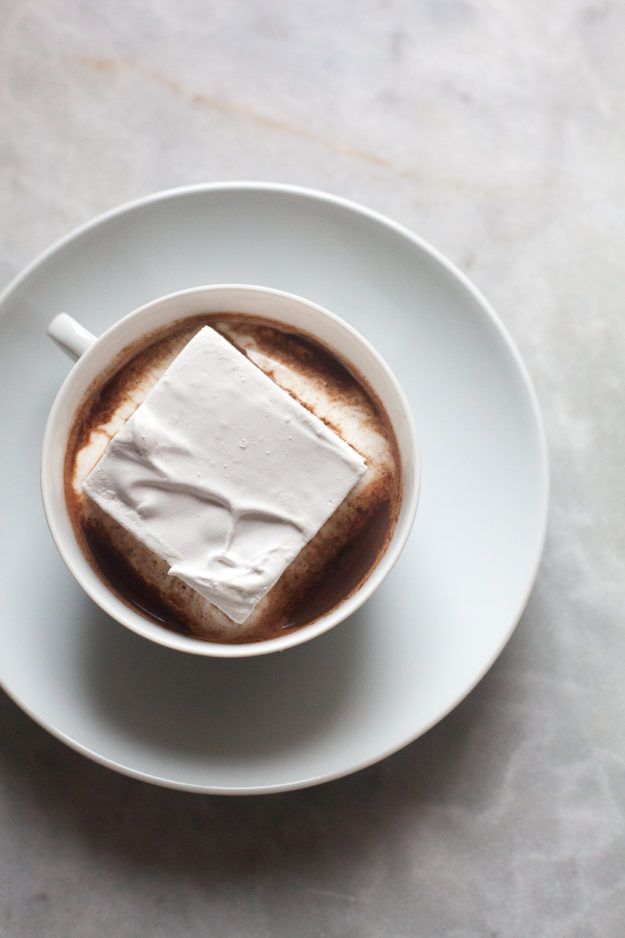 Square marshmallow in mug of hot cocoa | how to make homemade marshmallows | photo by Zoë François