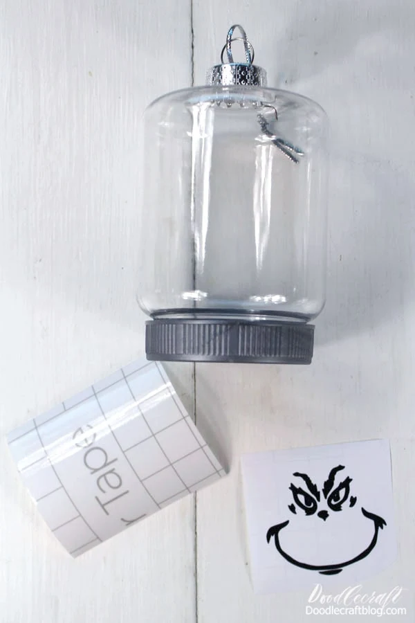Clean off the surface of the ornament with a little rubbing alcohol. Then place some transfer tape on the vinyl.