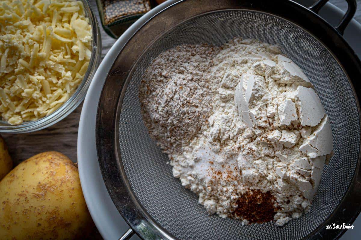 flour, cayenne, wholemeal flour, and salt in a sieve