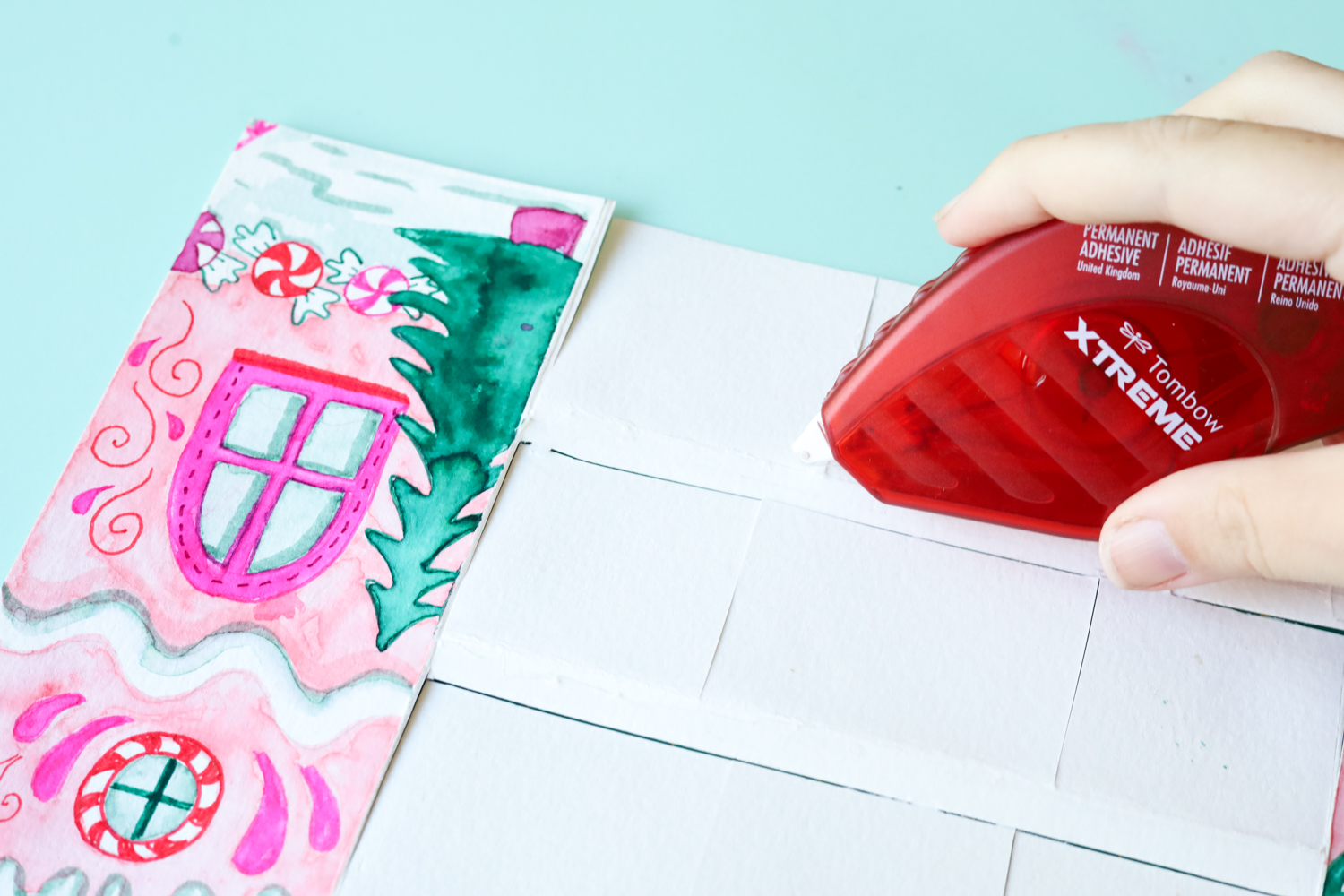 Use @tombowusa Tombow Xtreme Adhesive to adhere your DIY Advent Calendar to a piece of watercolor paper.