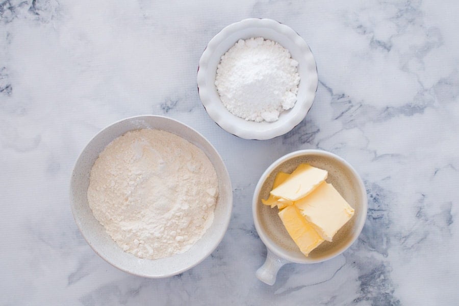 The ingredients for 3 ingredient shortbread - plain flour, icing sugar and butter. 