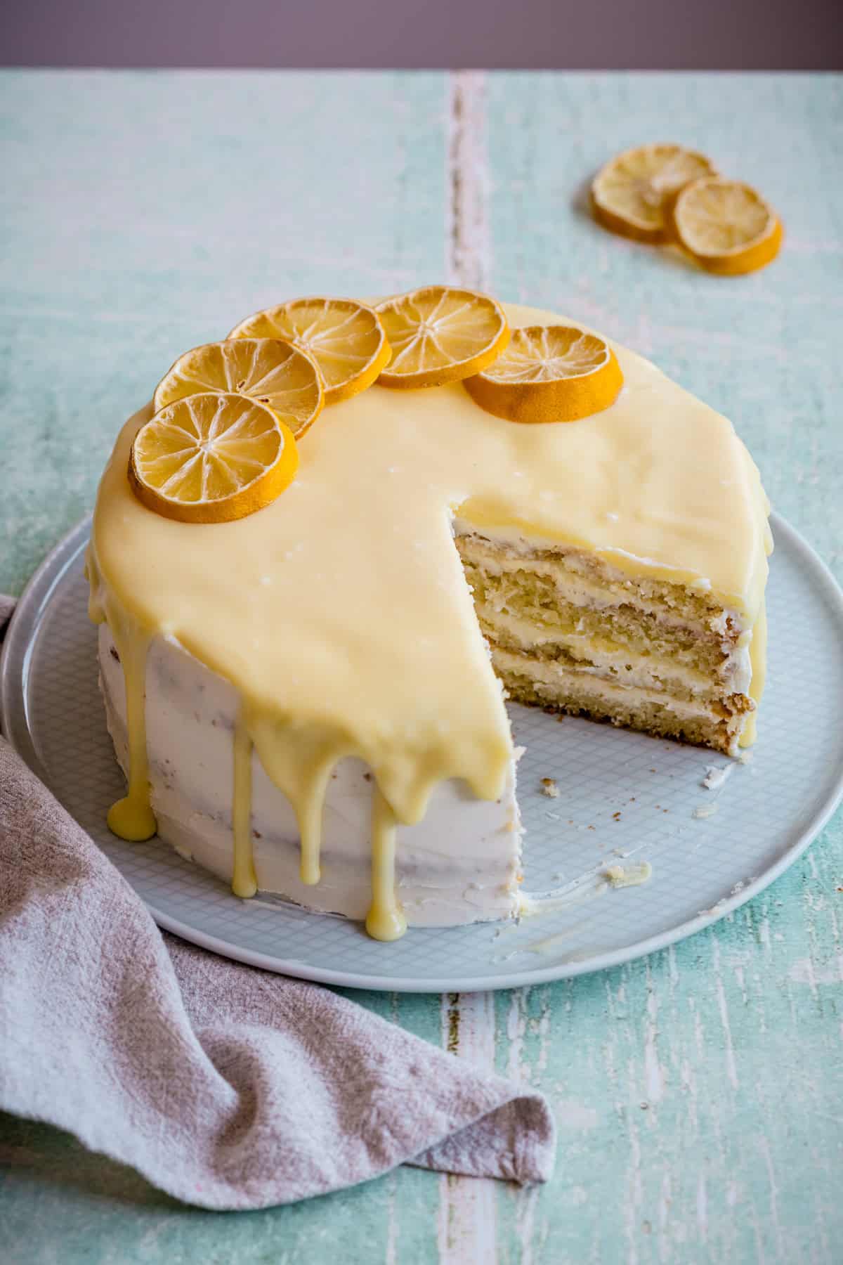 lemon mascarpone cake with two slices taken