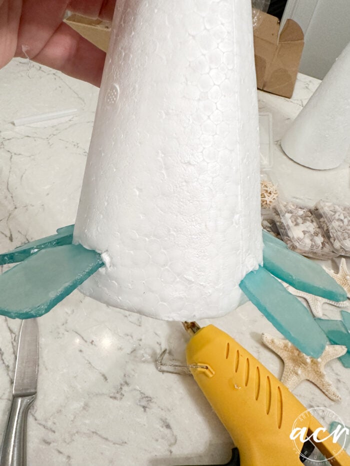 pieces of glass sticking out of the bottom of the cone foam