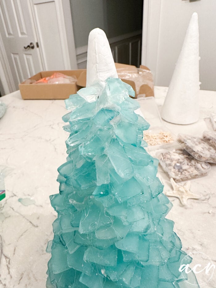 full tree with glass almost covering the whole tree