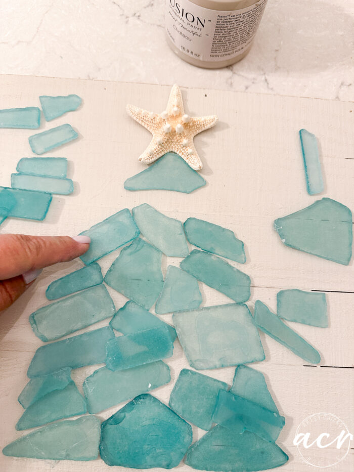 gluing the pieces down onto the board
