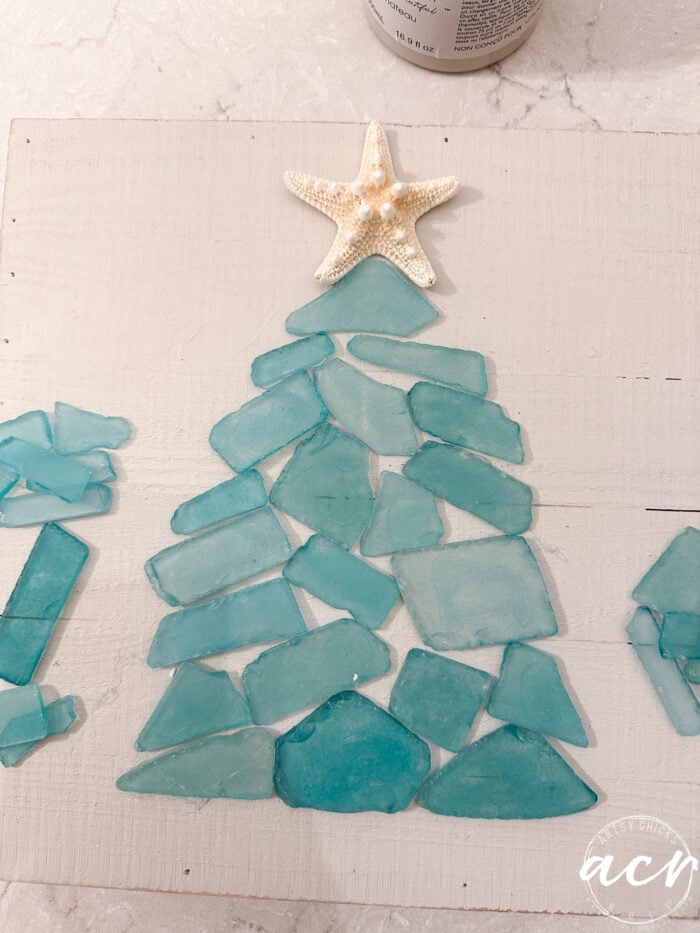 gluing starfish to top on board