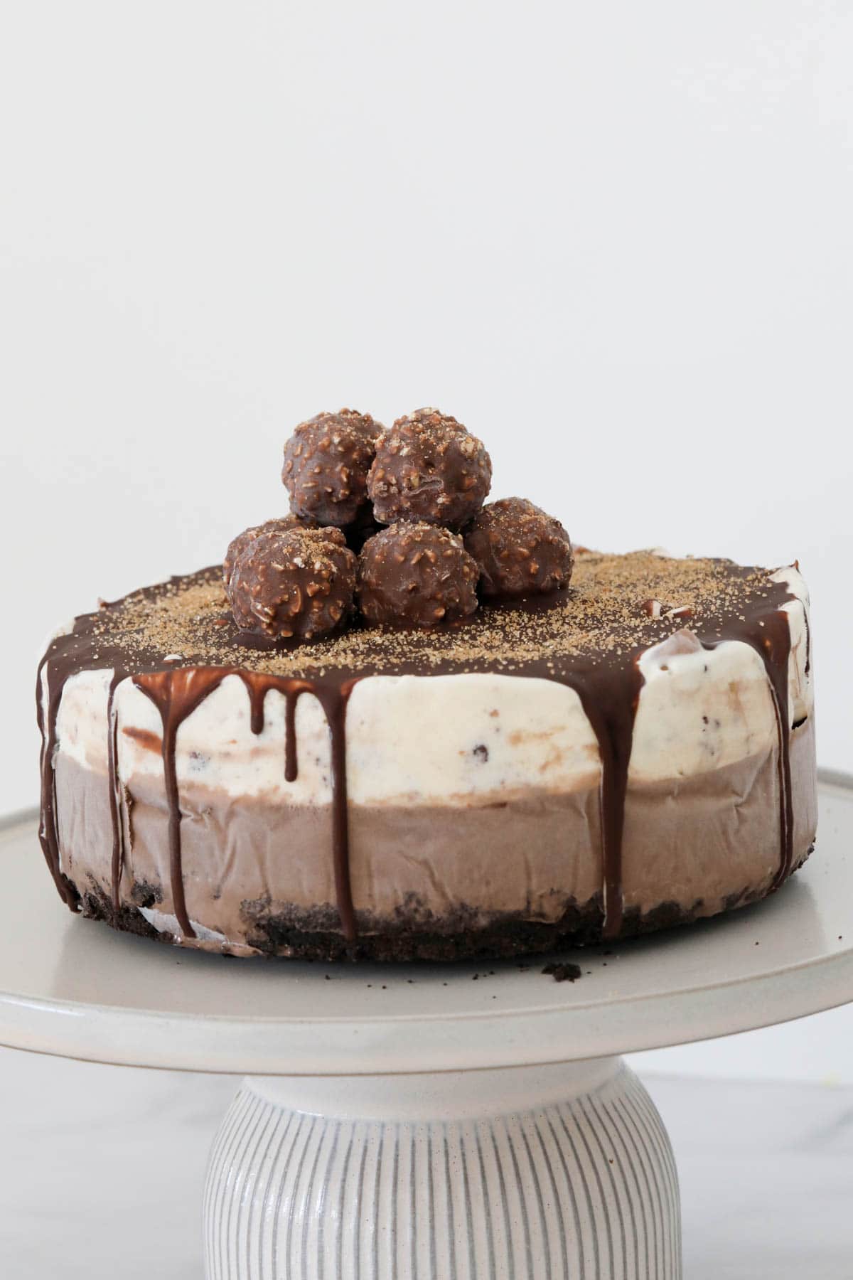 The chocolate hazelnut dessert on a cake stand.