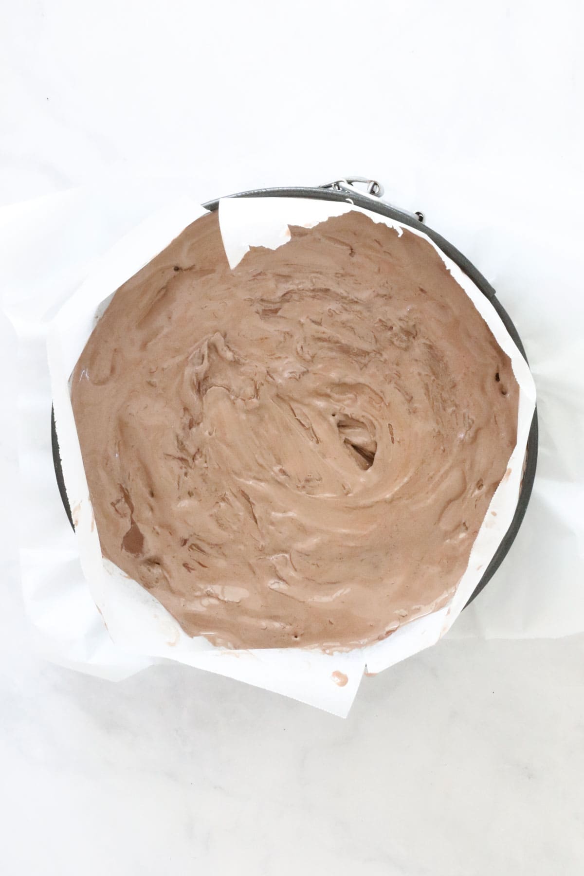 The chocolate Nutella layer smoothed out over the base.