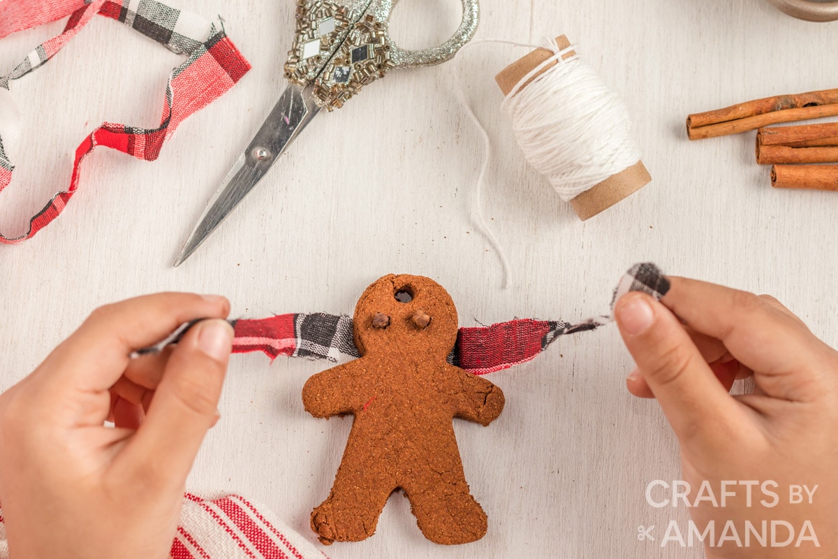 tying fabric scrap around ornament