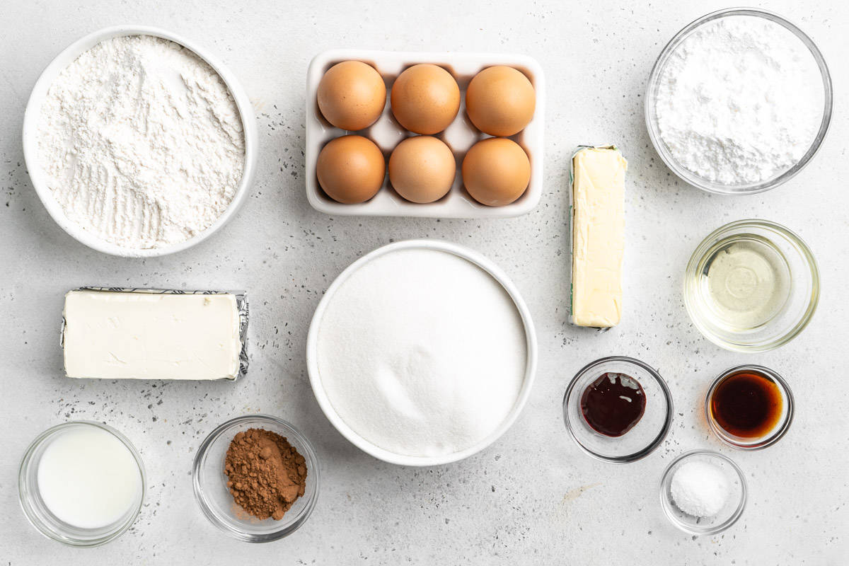 Ingredients to make red velvet marble cake on the counter before mixing up the cake.