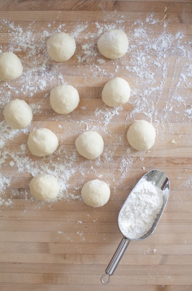 doughnut dough resting on butcher block