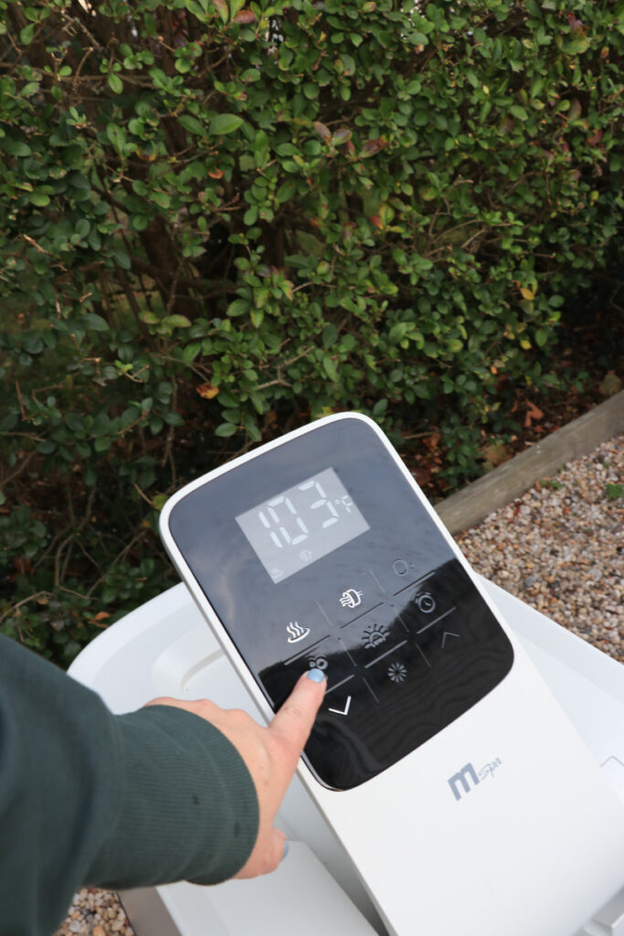 My New Portable Hot Tub the Oslo by Mspa. City Farmhouse by Jennifer O'Brien. Using the touch screen to modify the settings and turn on the jets.