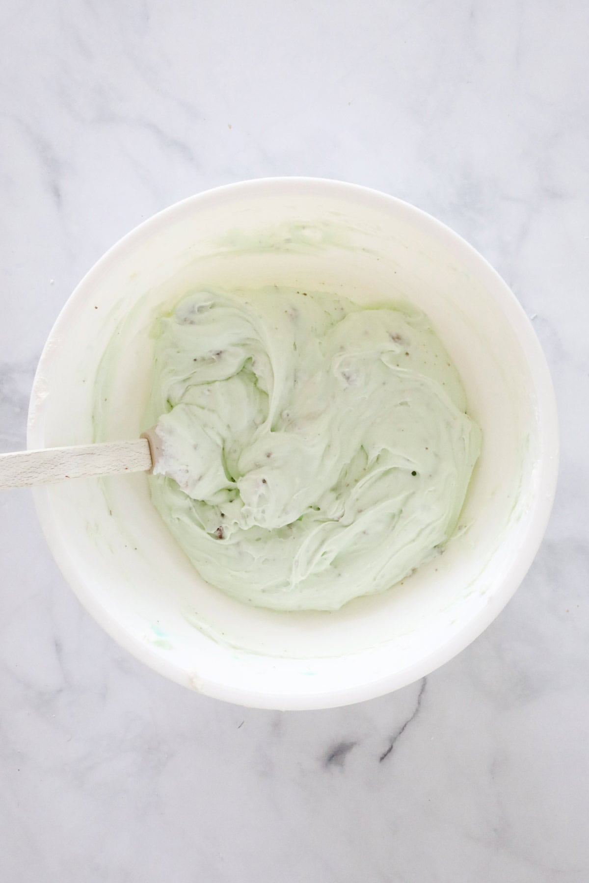The combined cheesecake filling in the mixing bowl.