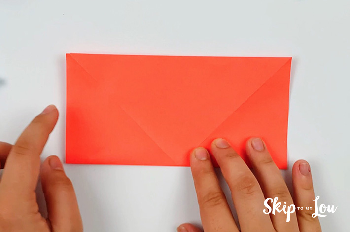 Two hands forming a rectangle after the fold has been made.