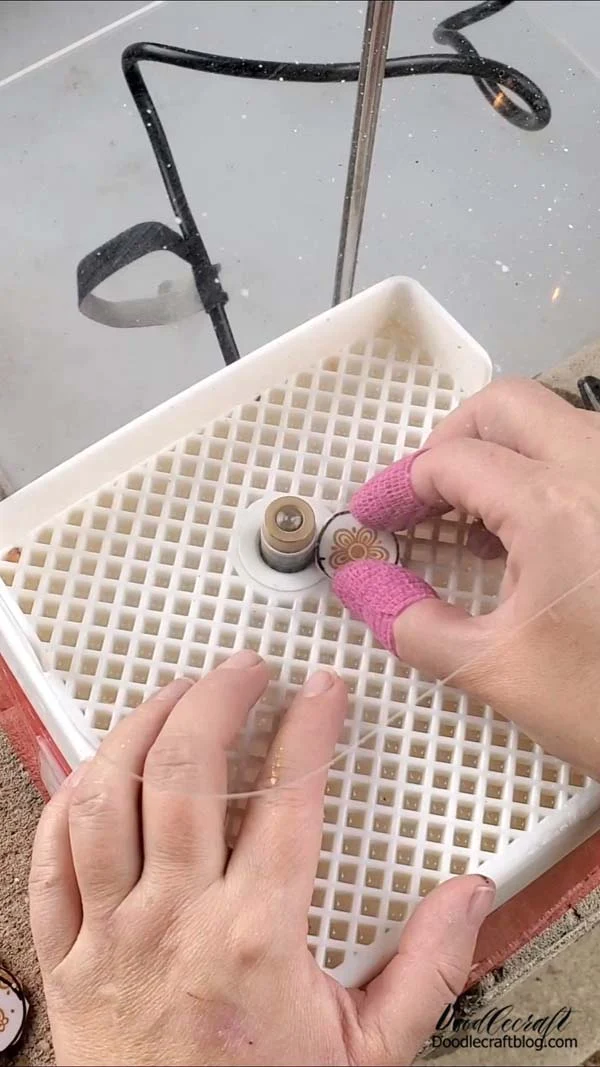 How to Make Corelle Plate Necklace Jewelry DIY! Step 3: Grinding Now use the water grinder to smooth out the edges of the glass/ceramic plates. Fill the tray with water and wrap your fingers in bandage to help protect your skin from getting cut into by the glass.