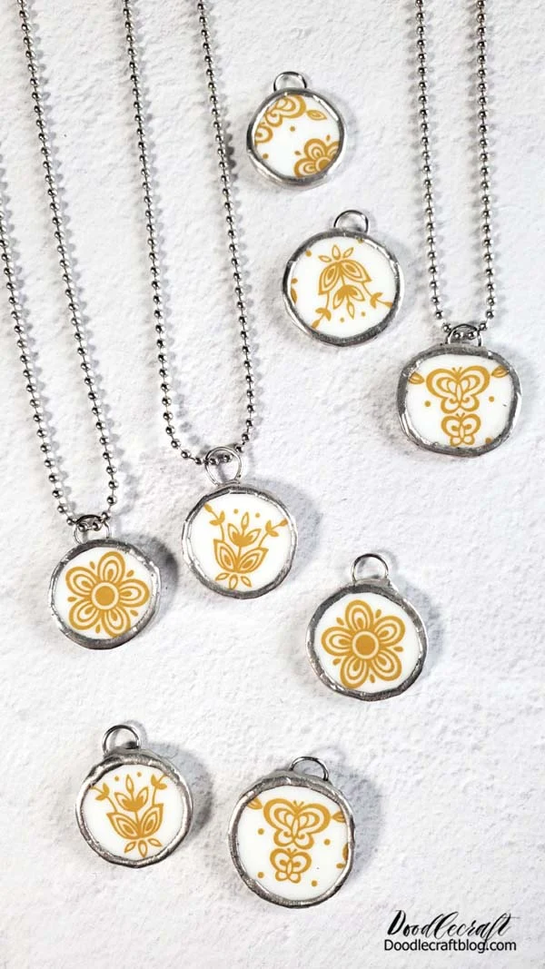 How to Make Corelle Plate Necklace Jewelry DIY! Now get creative with your vintage Corelle Plate pendants! These are ready to string on necklaces, add keychain hardware to or tie them up with a velvet ribbon for a darling Christmas tree ornament! So many fun vintage vibes with these pendants! Next time you are thrifting or at a yard sale keep an eye out for fun Corelle plates designs...or you drop and shatter a plate at your house, transform them into wearable art or fun heirloom pieces.