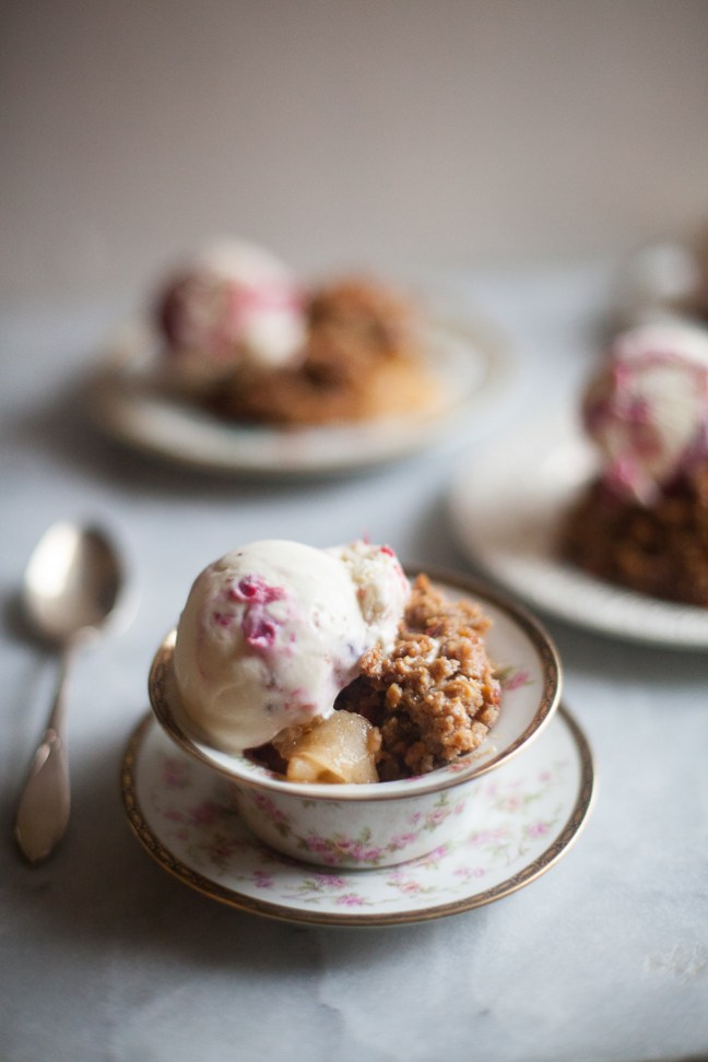Almond Apple Crisp served in tea cups with cranberry ice cream