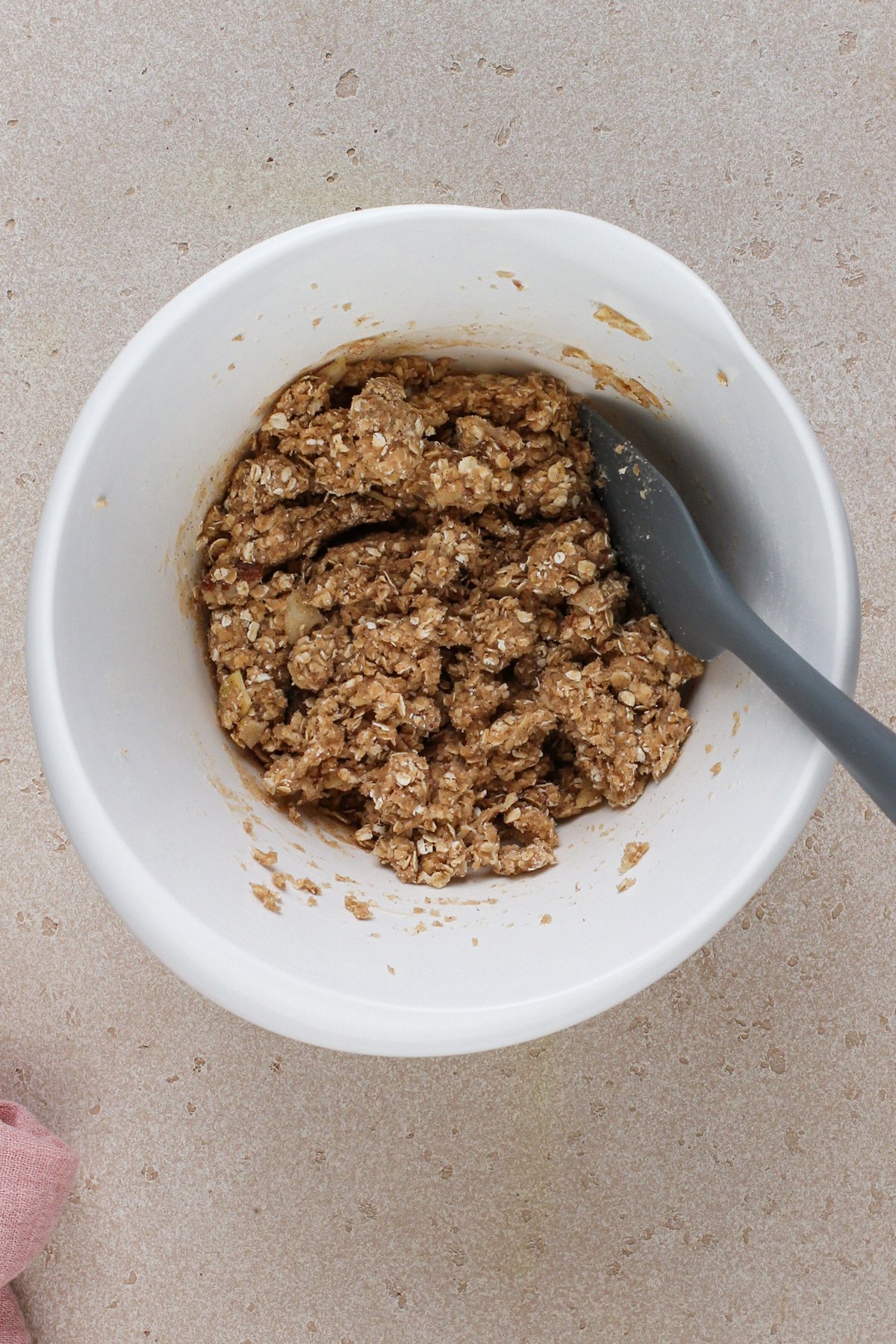 Dough for cherry cheesecake bar crust in a white bowl.